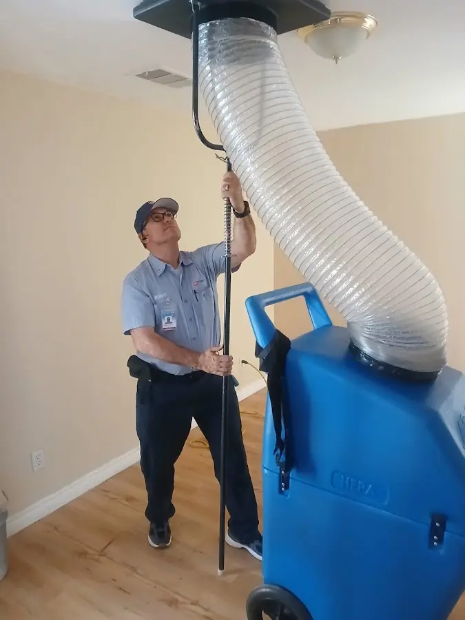 HVAC Installation technician using HEPA equipment in Hurley